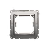 Simon Basic Adapter (przejściówka) na osprzęt standardu 45 × 45 mm. Montaż do puszki na łapki i wkręty srebrny mat BMA45M/43 KONTAKT