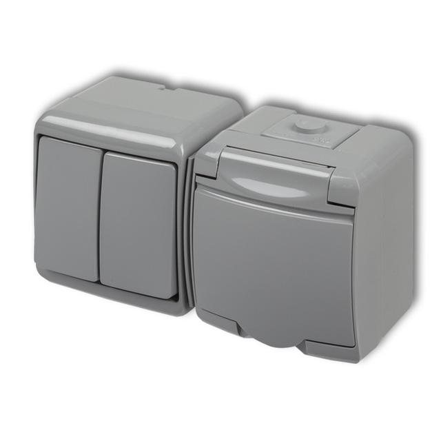 JUNIOR Łącznik świecznikowy z gniazdem pojedynczym z uziemieniem 2P+Z (klapka popielata; bez przesło